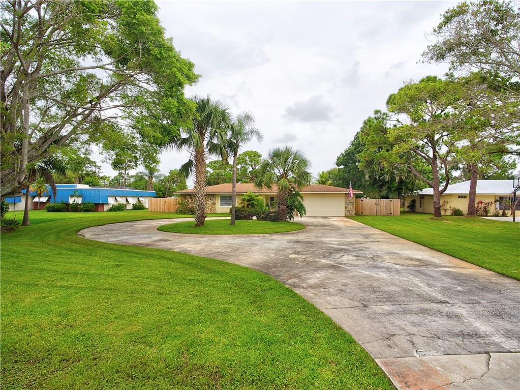 1139 Northwest Fork Road Stuart, FL 34994 - Photo 4 of 43 a view of a park with large trees