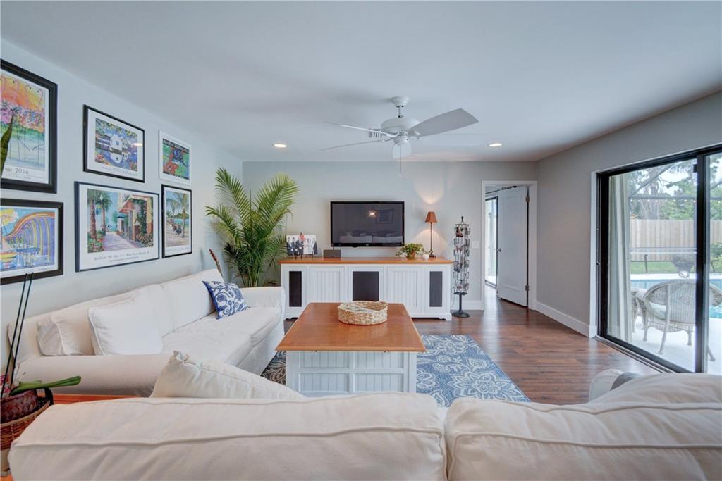 1139 Northwest Fork Road Stuart, FL 34994 - Photo 7 of 43 a living room with furniture and a flat screen tv