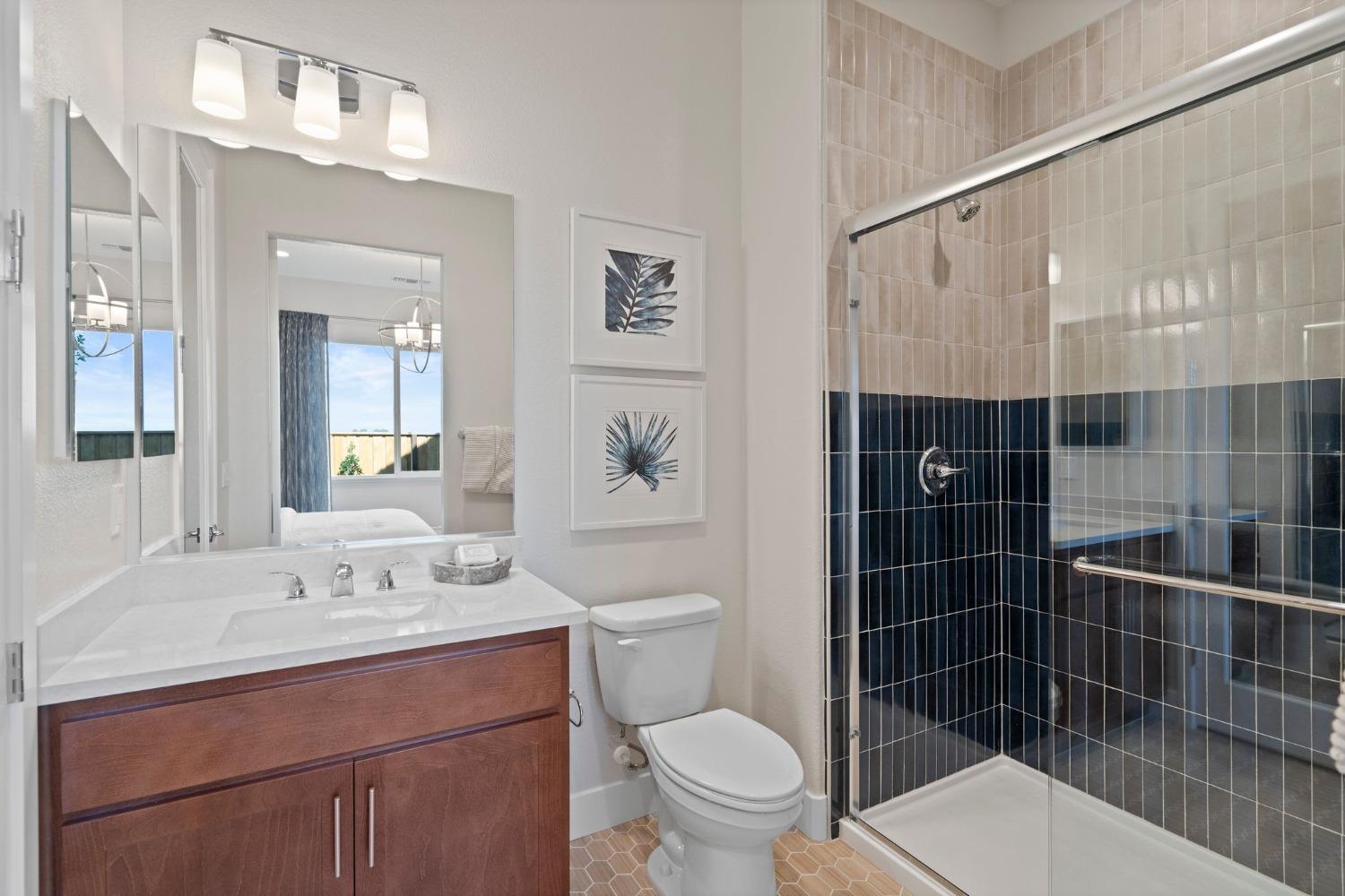 5542 Thomson Loop Davis, CA 95616 - Photo 25 of 63 a bathroom with a sink a toilet and shower