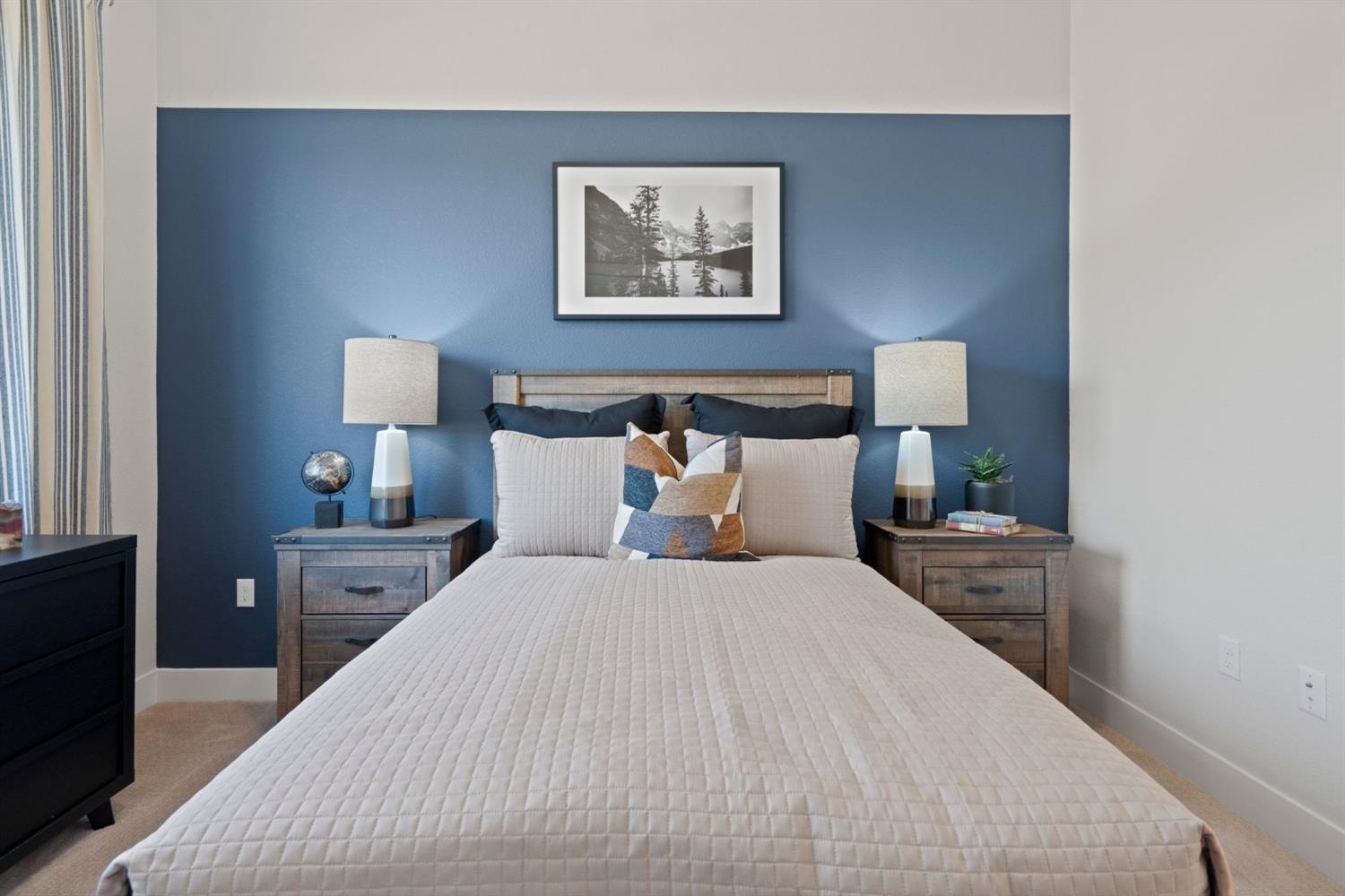 5542 Thomson Loop Davis, CA 95616 - Photo 33 of 63 a bedroom with bed and night stand