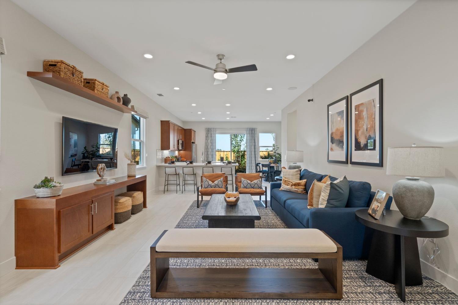 5542 Thomson Loop Davis, CA 95616 - Photo 4 of 63 a living room with furniture and a flat screen tv