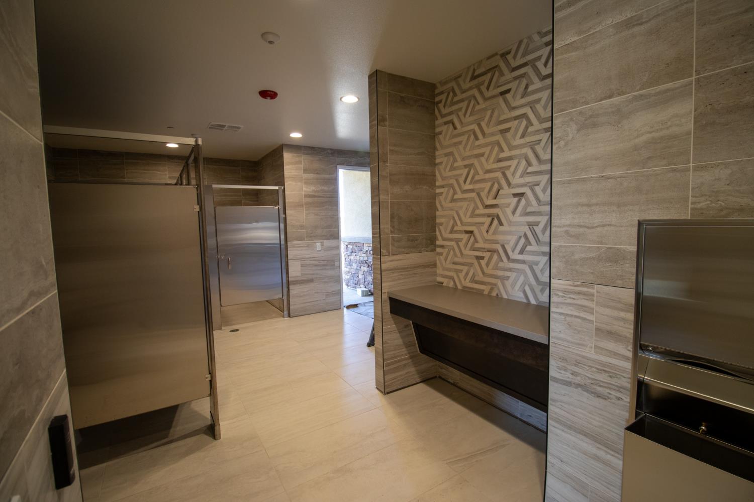 5542 Thomson Loop Davis, CA 95616 - Photo 47 of 63 a bathroom with a shower and a walk in closet