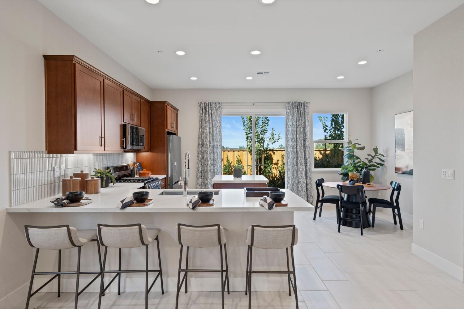 5542 Thomson Loop Davis, CA 95616 - Photo 10 of 63 a view of a dining room with furniture