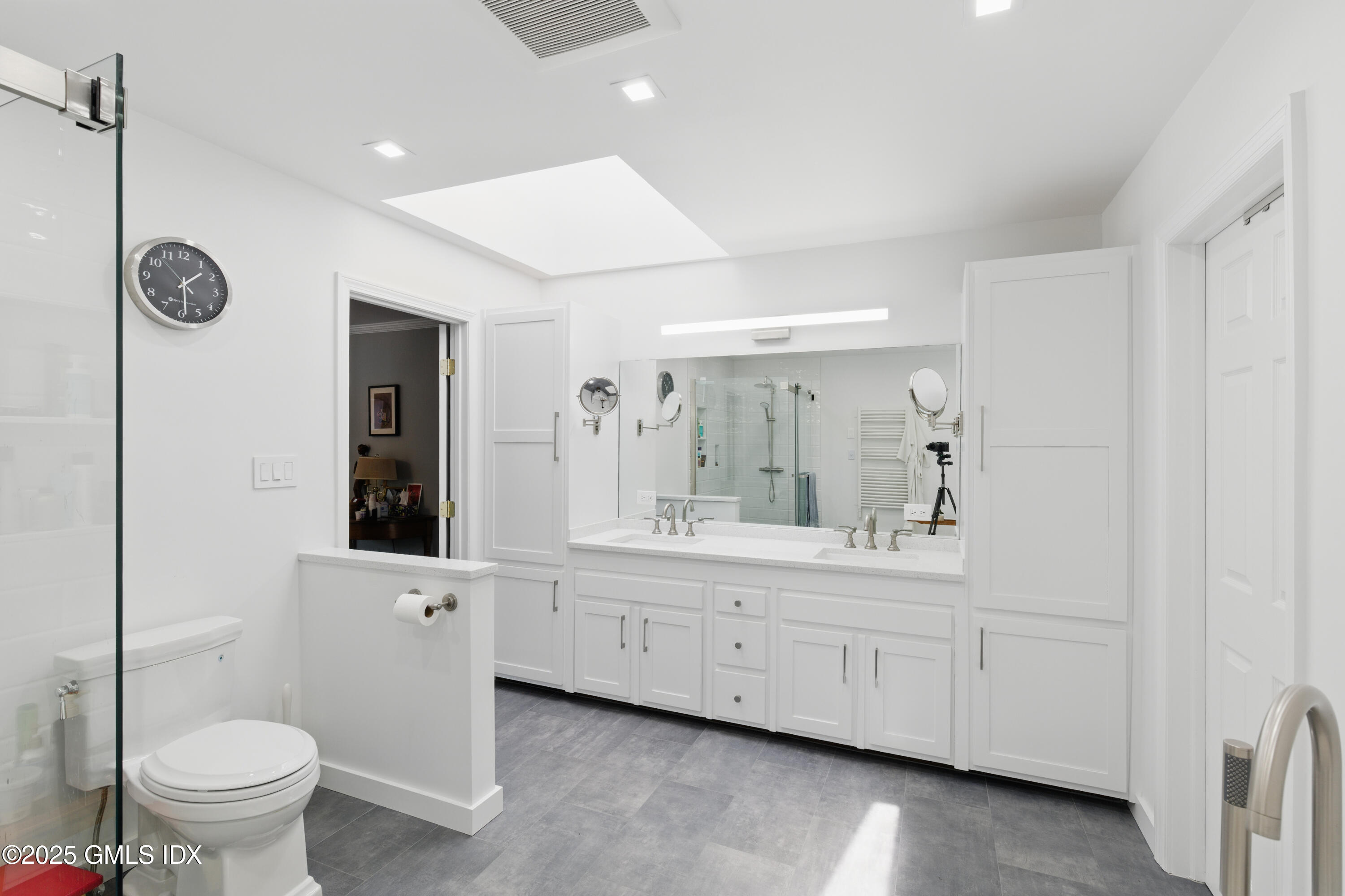 51 Orchard Place Greenwich, CT 06830 - Photo 12 of 18 a bathroom with a toilet a sink and mirror