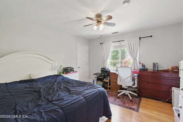 a bed room with a bed and a chandelier
