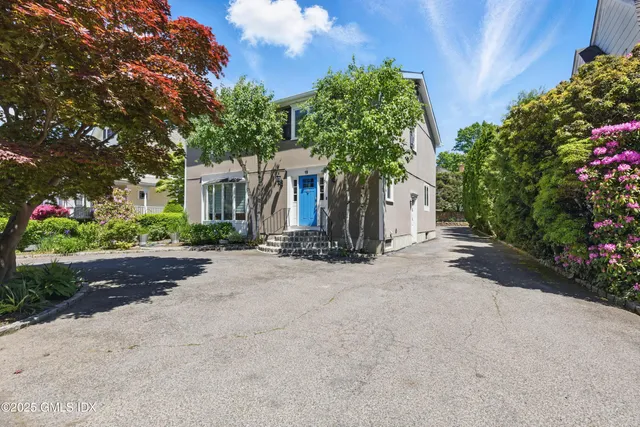 front view of a house with a street