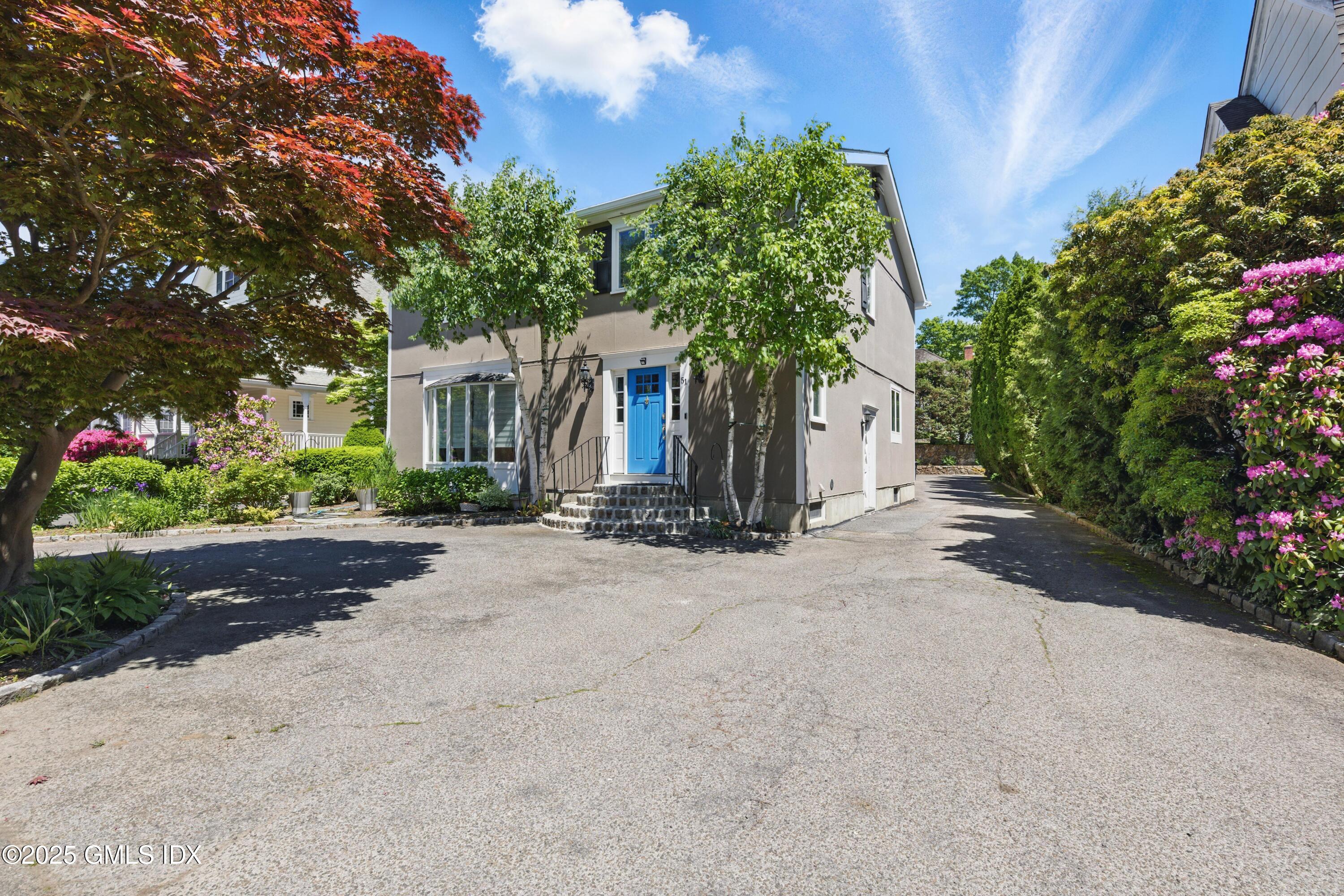 51 Orchard Place Greenwich, CT 06830 - Photo 16 of 18 front view of a house with a street