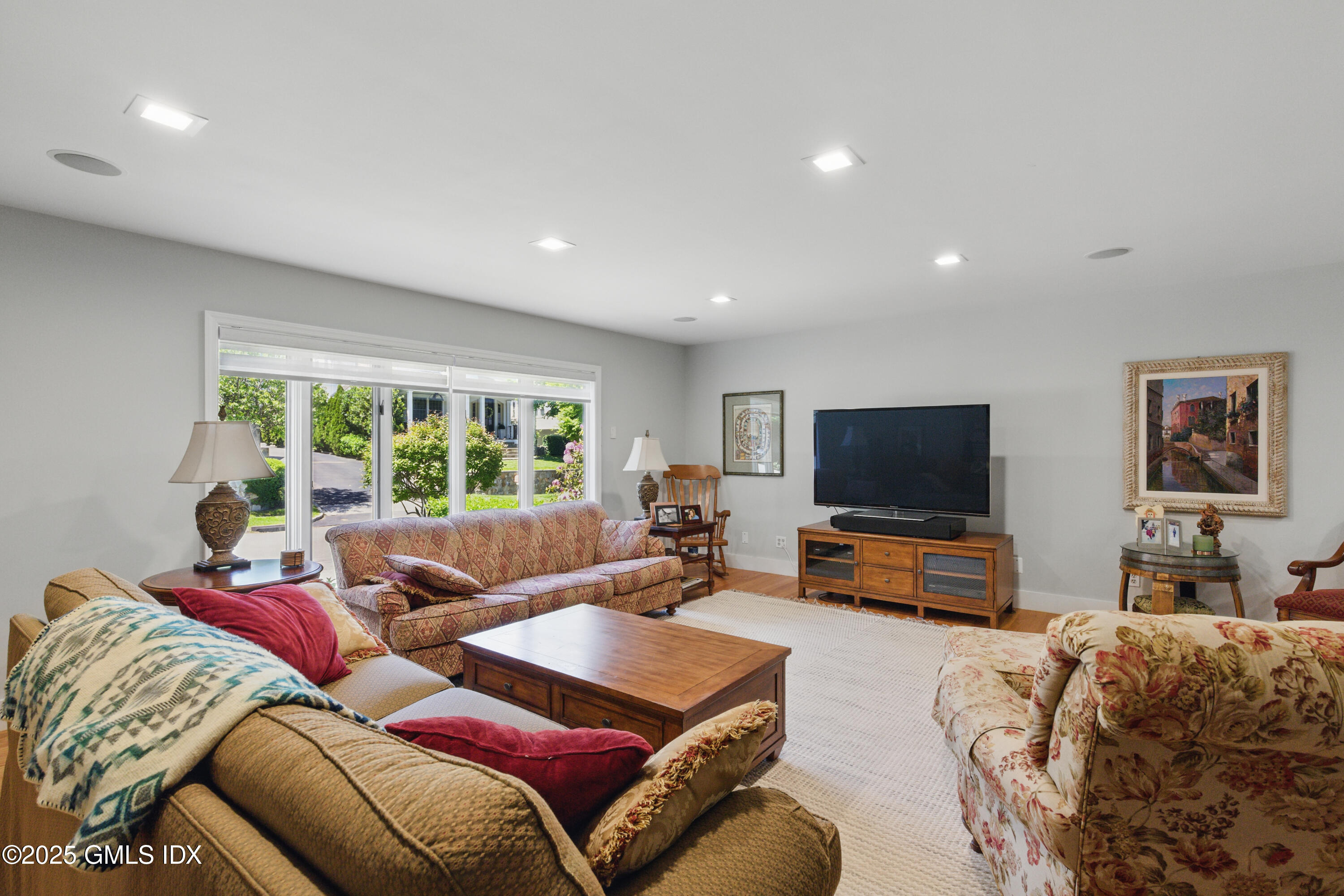 51 Orchard Place Greenwich, CT 06830 - Photo 3 of 18 a living room with furniture and a flat screen tv