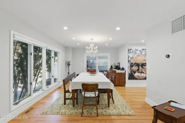 a view of a dining room with furniture window and wooden floor
