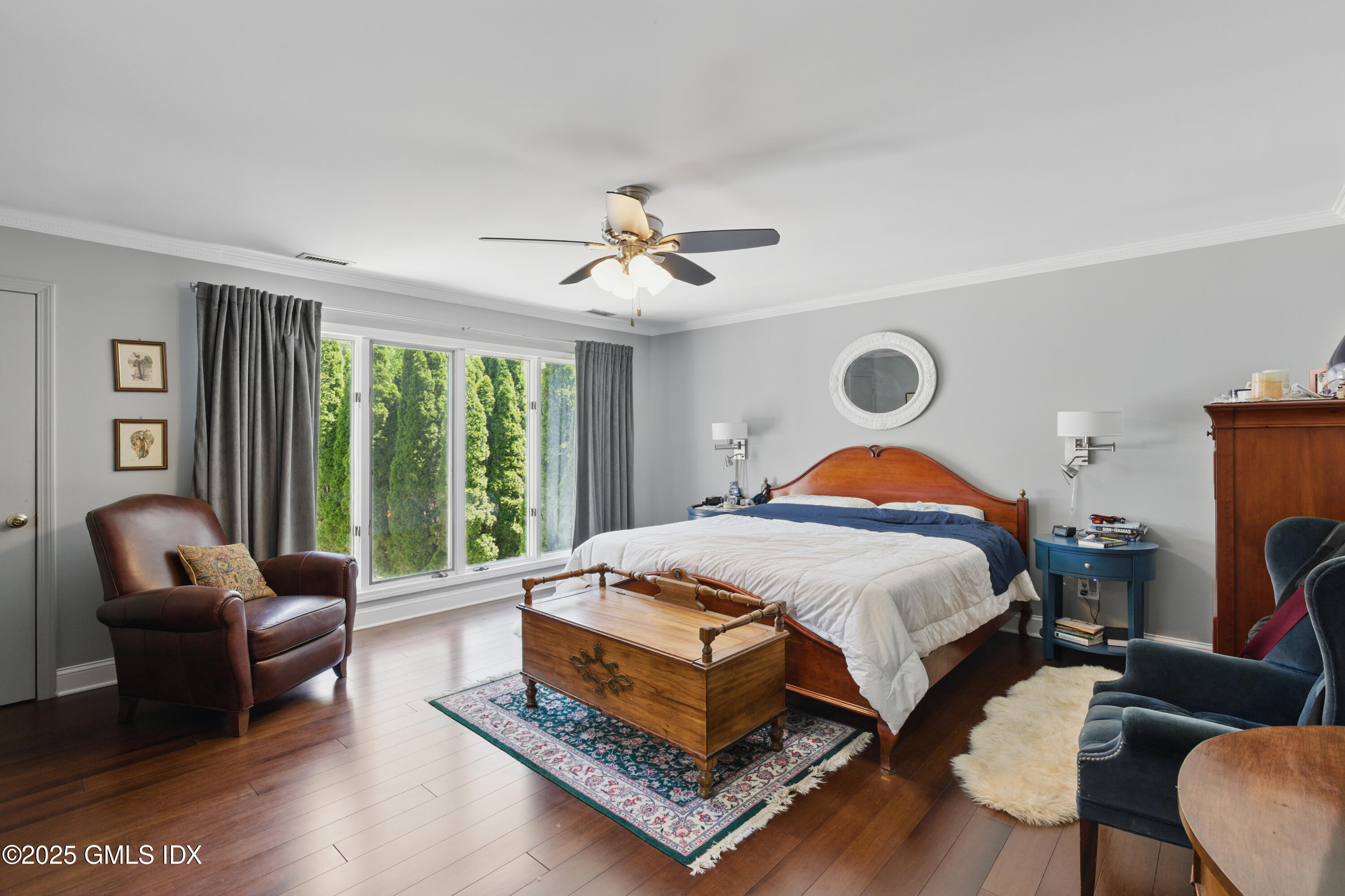 51 Orchard Place Greenwich, CT 06830 - Photo 10 of 18 a bedroom with a bed a couch and a large window with the outer view