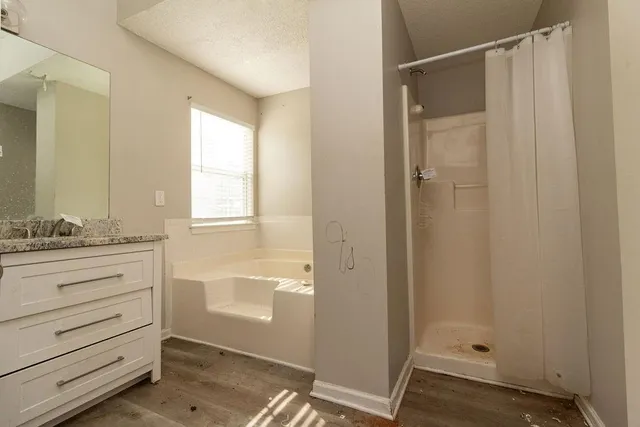 a bathroom with a shower and a sink