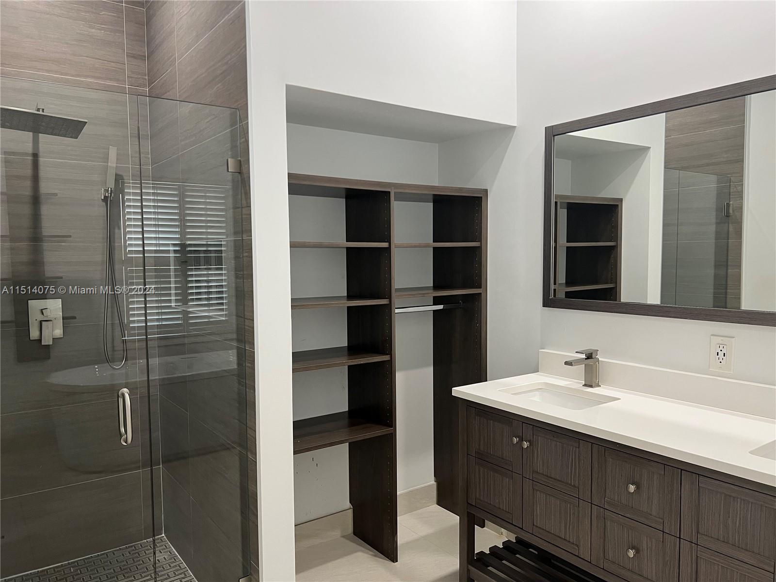 Savanna Weston, FL 33327 - Photo 12 of 26 a bathroom with a sink and a mirror