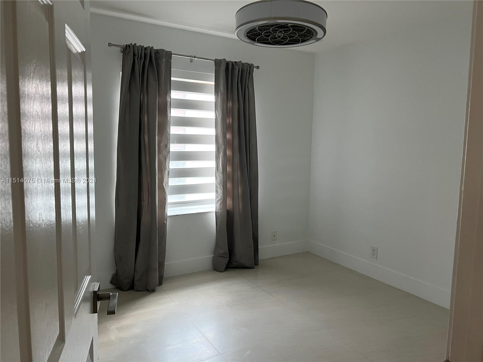 Savanna Weston, FL 33327 - Photo 15 of 26 an empty room with a empty space and windows