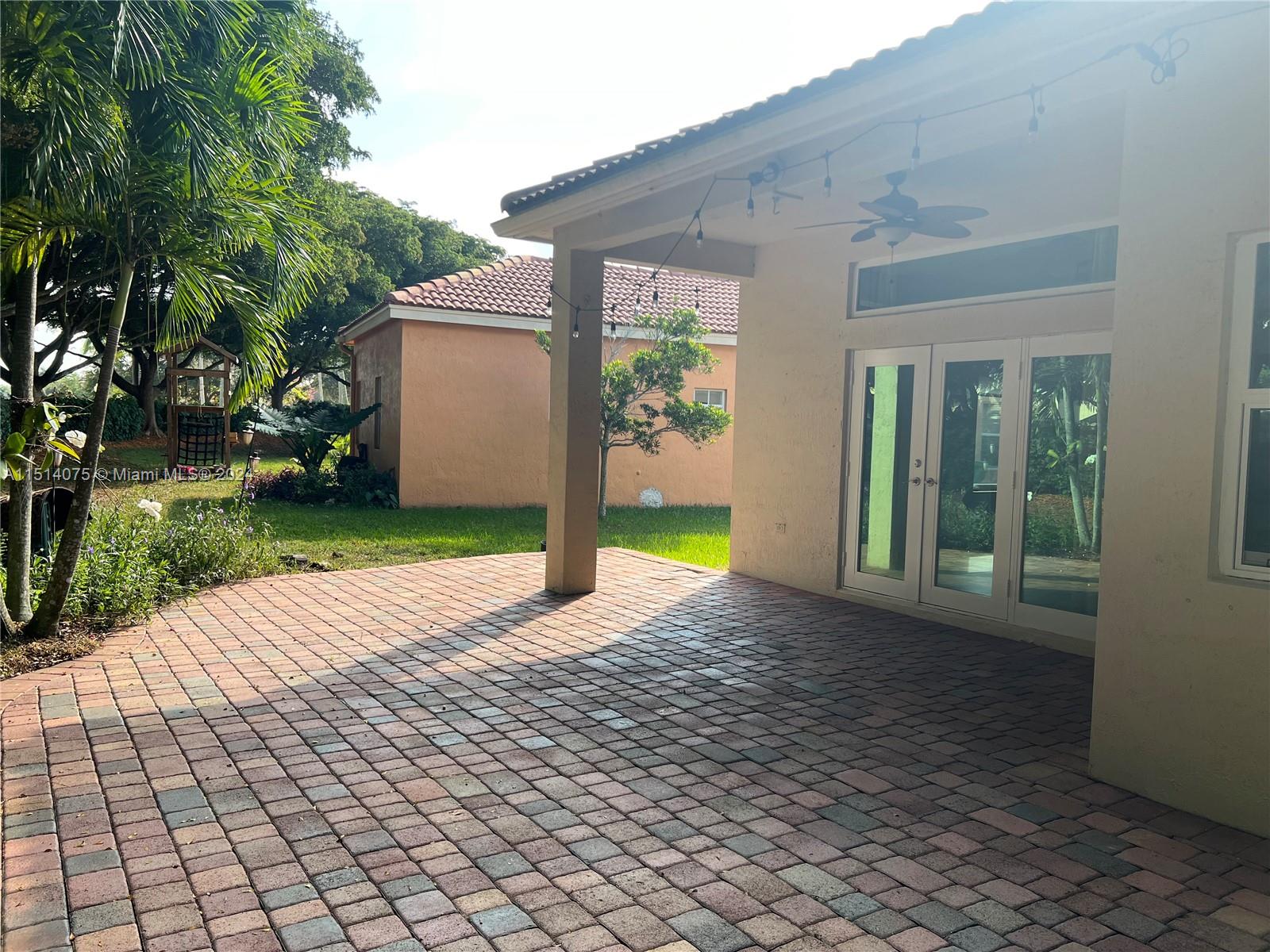 Savanna Weston, FL 33327 - Photo 23 of 26 a view of a house with backyard and garden