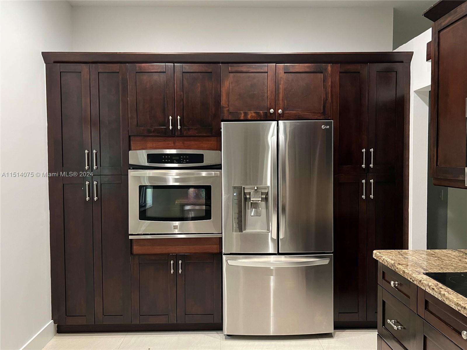 Savanna Weston, FL 33327 - Photo 4 of 26 a metallic refrigerator freezer sitting in a kitchen