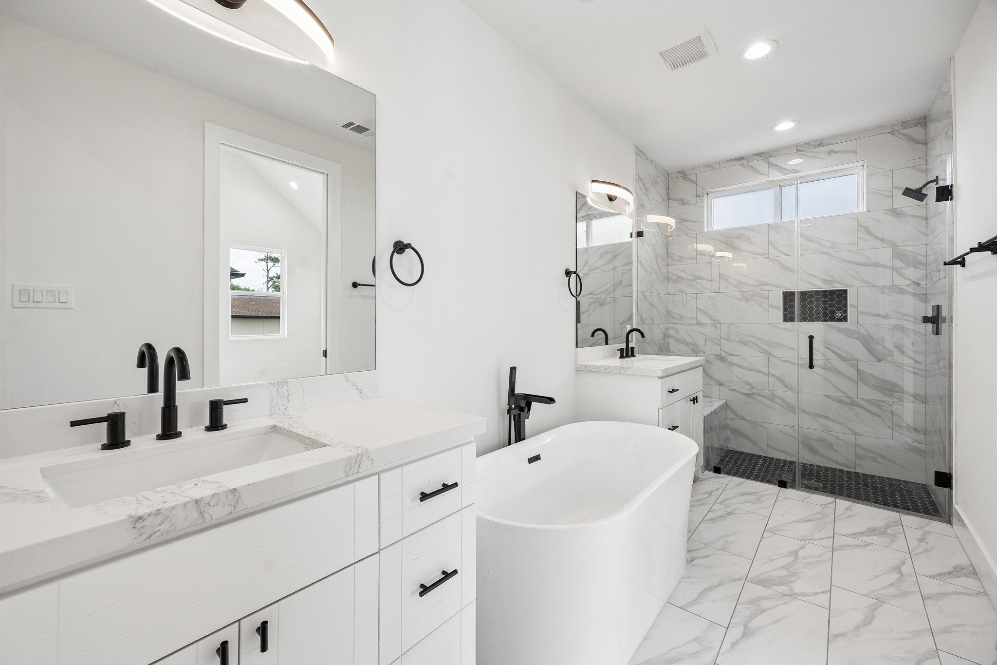 424 Sikes Street Houston, TX 77018 - Photo 6 of 12 a bathroom with a sink a toilet and shower