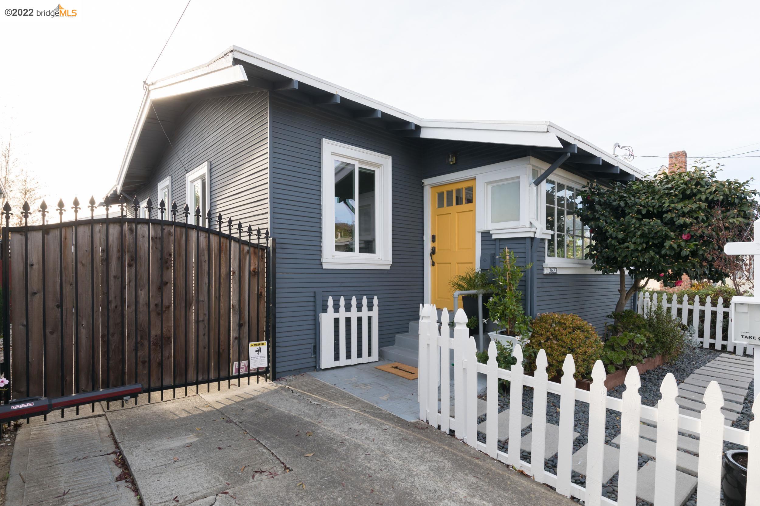 3623 Redding Street Oakland, CA 94619 - Photo 1 of 1 a front view of house with wooden fence