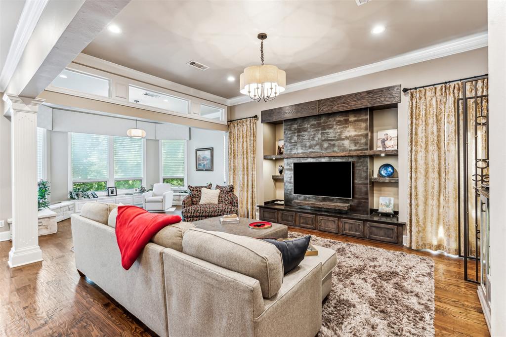 1815 West Forest Grove Road Lucas, TX 75002 - Photo 1 of 40 Living area featuring crown molding, decorative columns, and visible vents
