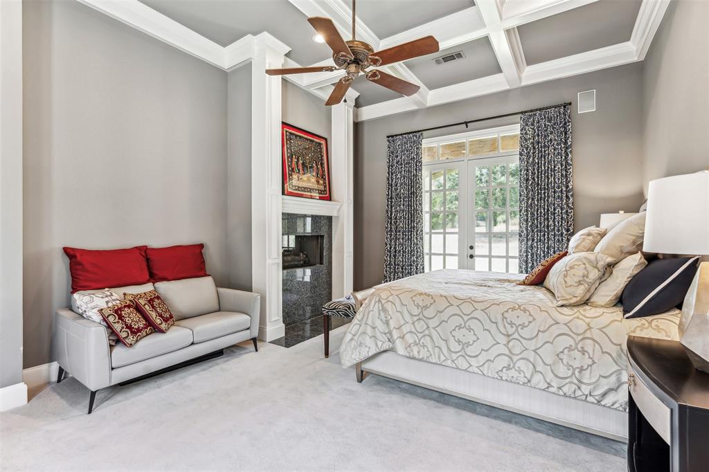 1815 West Forest Grove Road Lucas, TX 75002 - Photo 14 of 40 Bedroom featuring a premium fireplace, beam ceiling, carpet floors, coffered ceiling, and access to outside