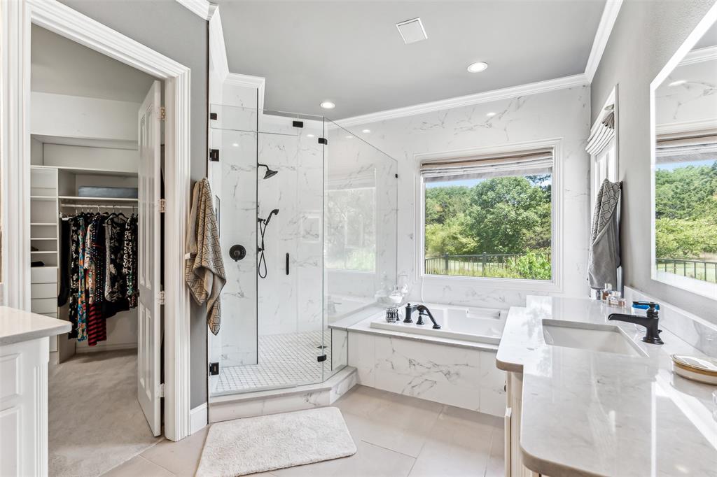 1815 West Forest Grove Road Lucas, TX 75002 - Photo 16 of 40 Full bathroom with a marble finish shower, vanity, a garden tub, and ornamental molding