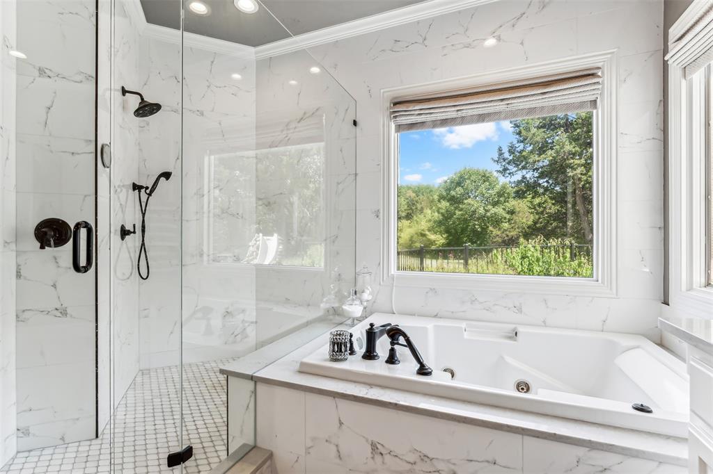 1815 West Forest Grove Road Lucas, TX 75002 - Photo 17 of 40 Bathroom featuring a marble finish shower, a jetted tub, and crown molding