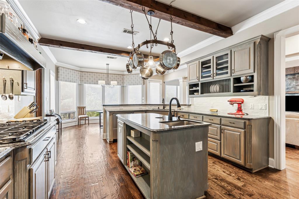1815 West Forest Grove Road Lucas, TX 75002 - Photo 19 of 40 Kitchen with open shelves, beamed ceiling, a peninsula, and a sink