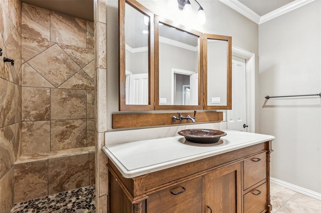 1815 West Forest Grove Road Lucas, TX 75002 - Photo 27 of 40 Full bath featuring vanity, crown molding, baseboards, and a tile shower