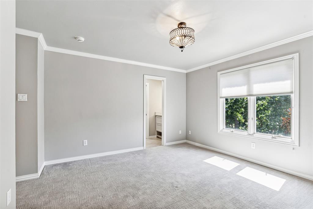 1815 West Forest Grove Road Lucas, TX 75002 - Photo 28 of 40 Carpeted spare room featuring crown molding and baseboards
