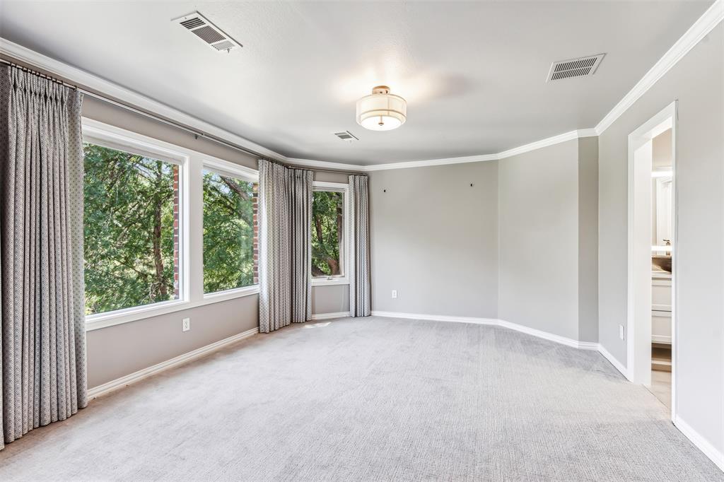 1815 West Forest Grove Road Lucas, TX 75002 - Photo 31 of 40 Unfurnished room featuring baseboards, light colored carpet, visible vents, and ornamental molding