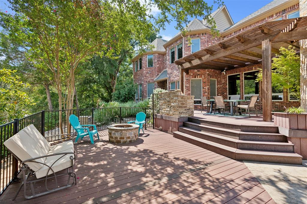 1815 West Forest Grove Road Lucas, TX 75002 - Photo 36 of 40 Wooden terrace with a pergola and an outdoor fire pit
