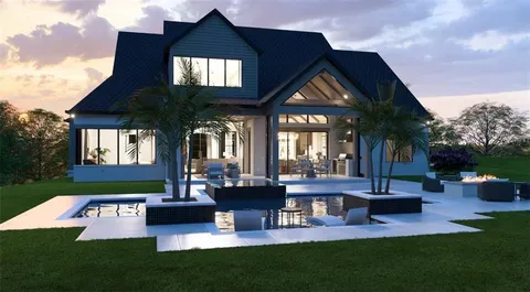 a front view of house with yard and outdoor seating