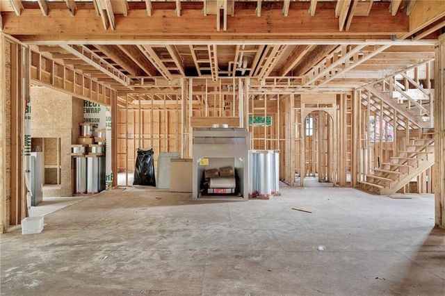 a view of a room with wooden walls