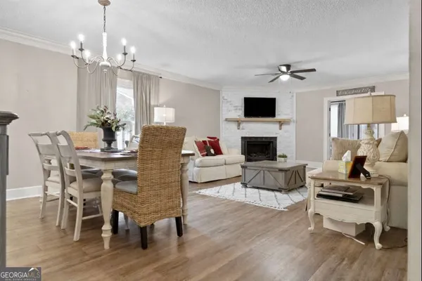 a living room with furniture fireplace and a flat screen tv