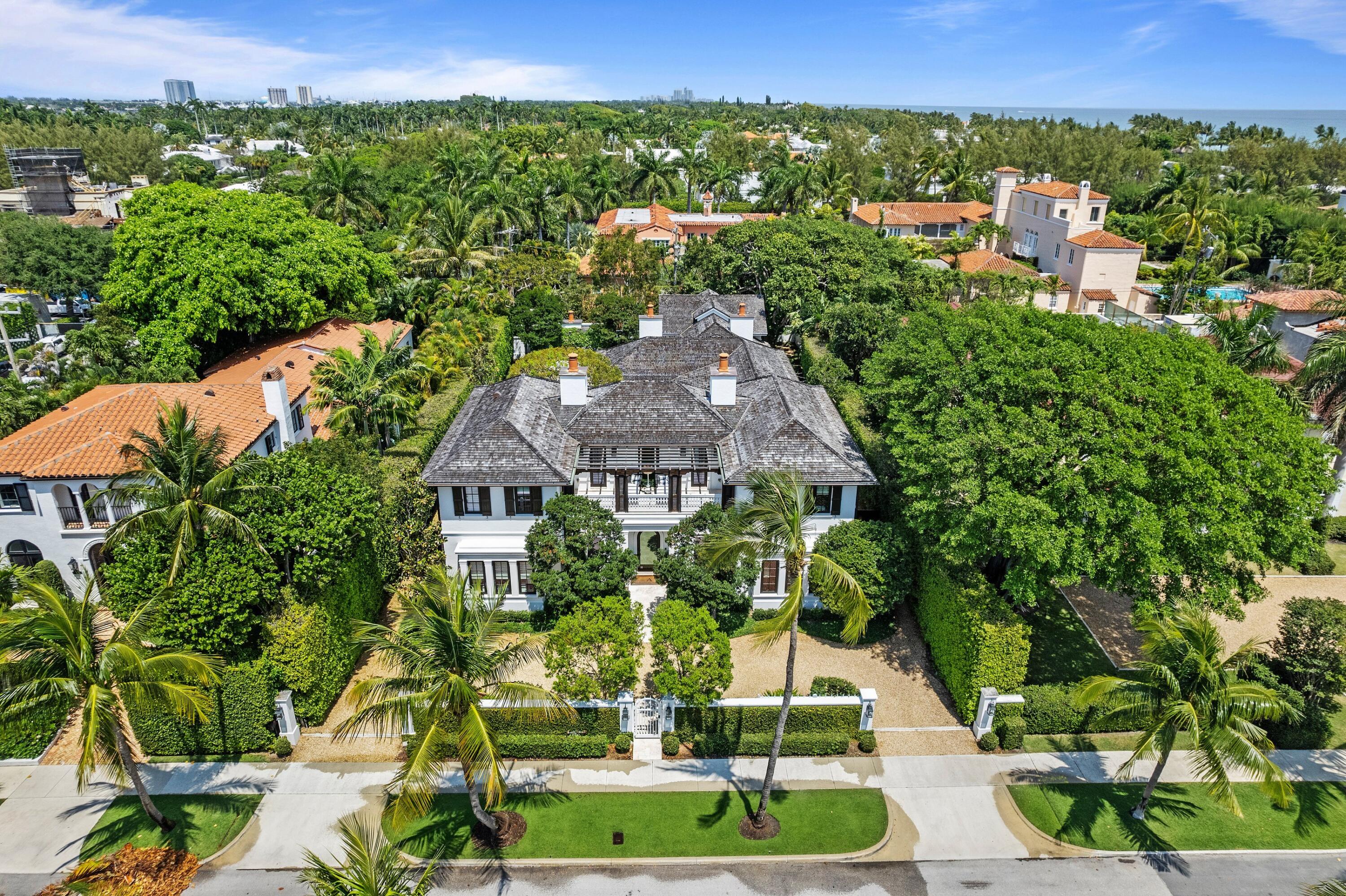 167 Dunbar Road Palm Beach, FL 33480 - Photo 2 of 3 an aerial view of a house with a yard and lake view