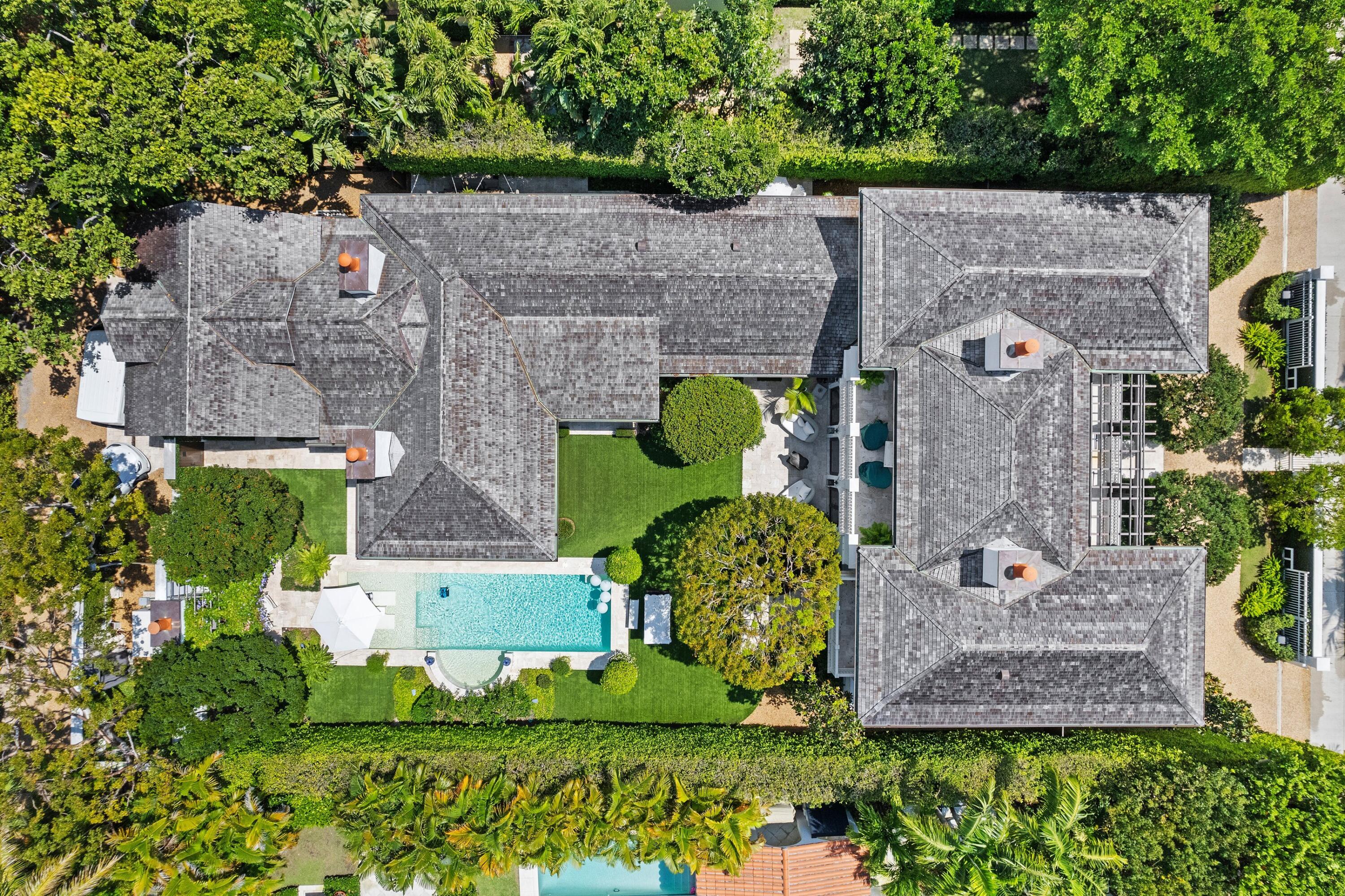 167 Dunbar Road Palm Beach, FL 33480 - Photo 3 of 3 an aerial view of a house with a garden and large trees