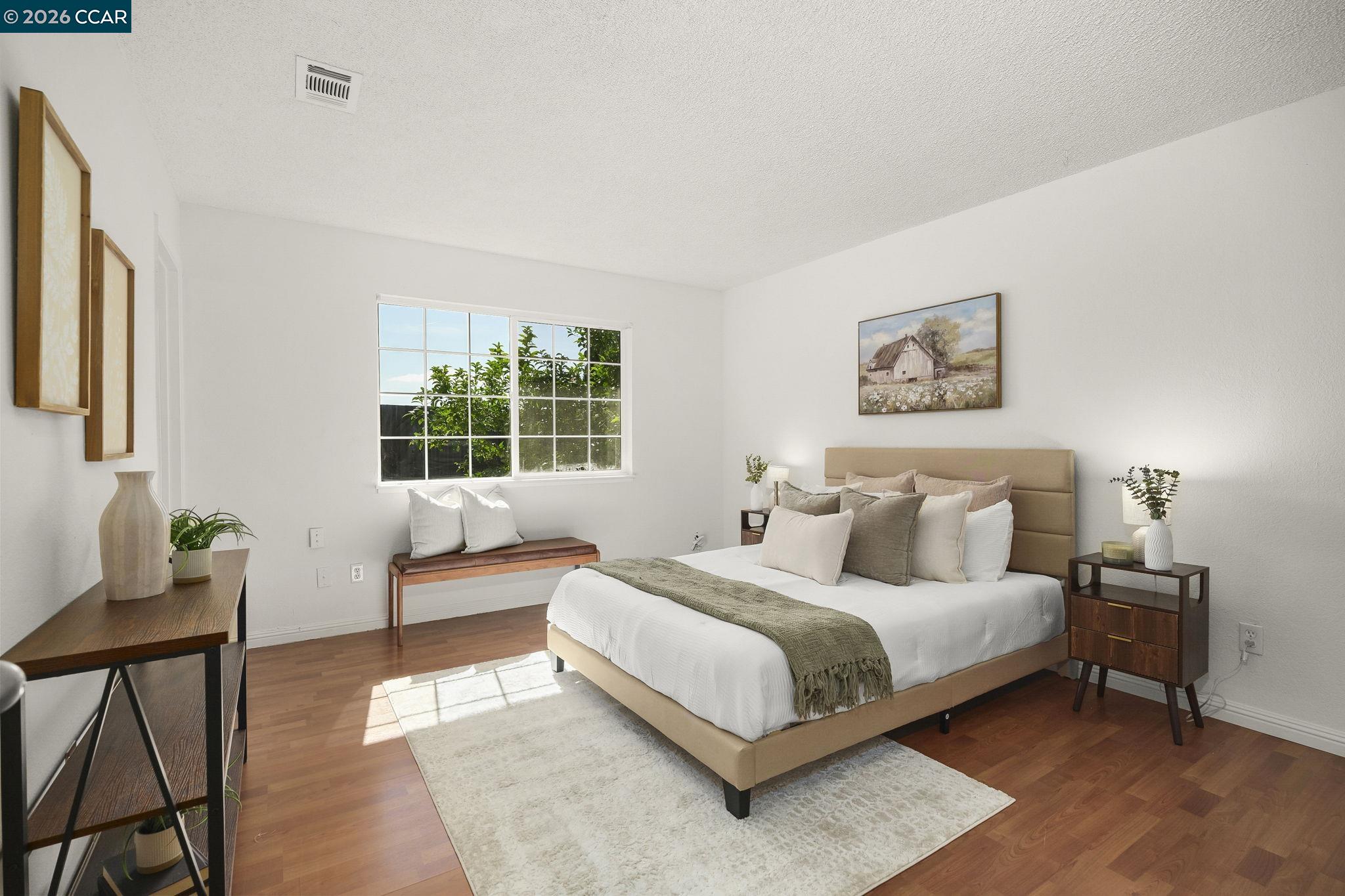 476 Pamela Drive Bay Point, CA 94565 - Photo 4 of 24 a bedroom with a bed and wooden floor