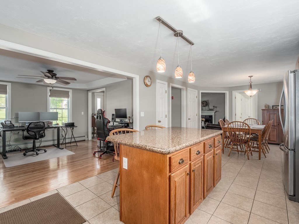 4 Haven Hill Road Rutland, MA 01543 - Photo 17 of 37 a large kitchen with kitchen island a sink table and chairs