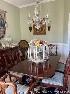6565 Maxwell Road Stedman, NC 28391 - Photo 12 of 48 a view of a dining room with furniture and chandelier