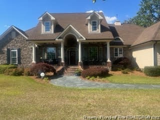 6565 Maxwell Road Stedman, NC 28391 - Photo 3 of 48 a view of a house with patio