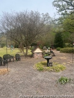 6565 Maxwell Road Stedman, NC 28391 - Photo 38 of 48 a backyard of a house with table and chairs