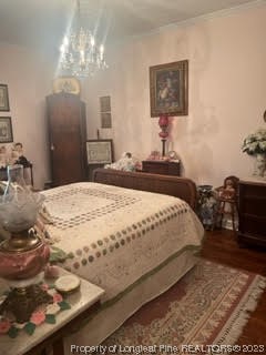 6565 Maxwell Road Stedman, NC 28391 - Photo 40 of 48 a bedroom with a bed and a chandelier