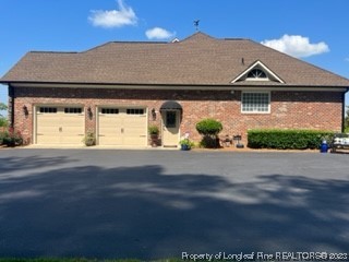 6565 Maxwell Road Stedman, NC 28391 - Photo 4 of 48 a front view of a house with a yard