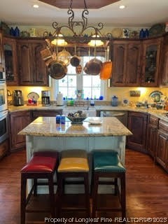 6565 Maxwell Road Stedman, NC 28391 - Photo 8 of 48 a dining room with granite countertop lots of wooden furniture
