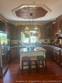 6565 Maxwell Road Stedman, NC 28391 - Photo 9 of 48 a kitchen with a dining table chairs and refrigerator