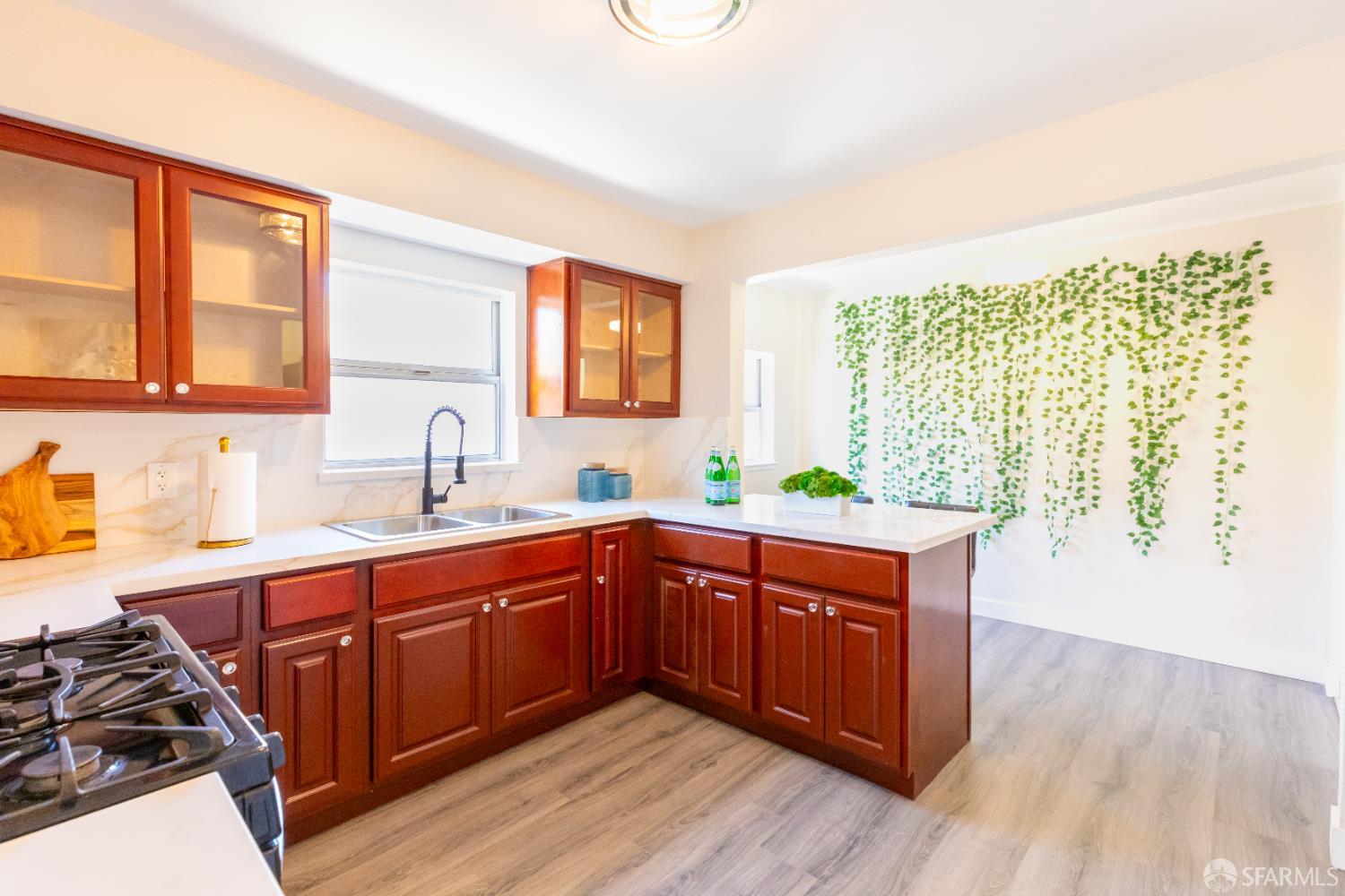 808 Fourth Street Rodeo, CA 94572 - Photo 15 of 70 a kitchen with stainless steel appliances granite countertop wooden cabinets and a large window