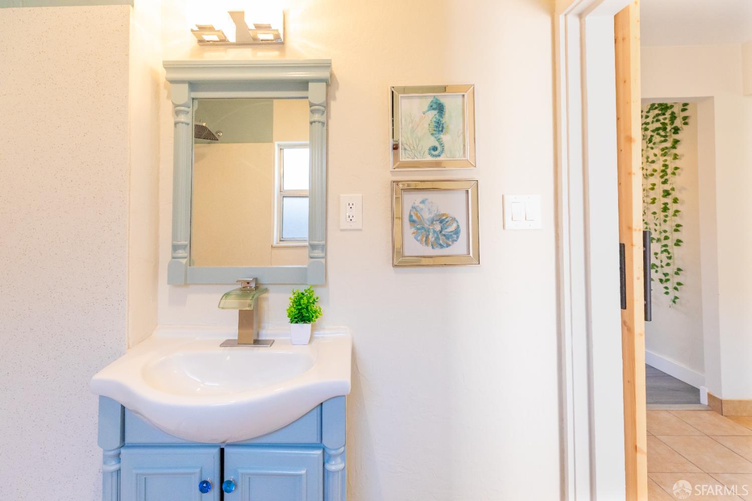808 Fourth Street Rodeo, CA 94572 - Photo 22 of 70 a bathroom with a sink a mirror and a window