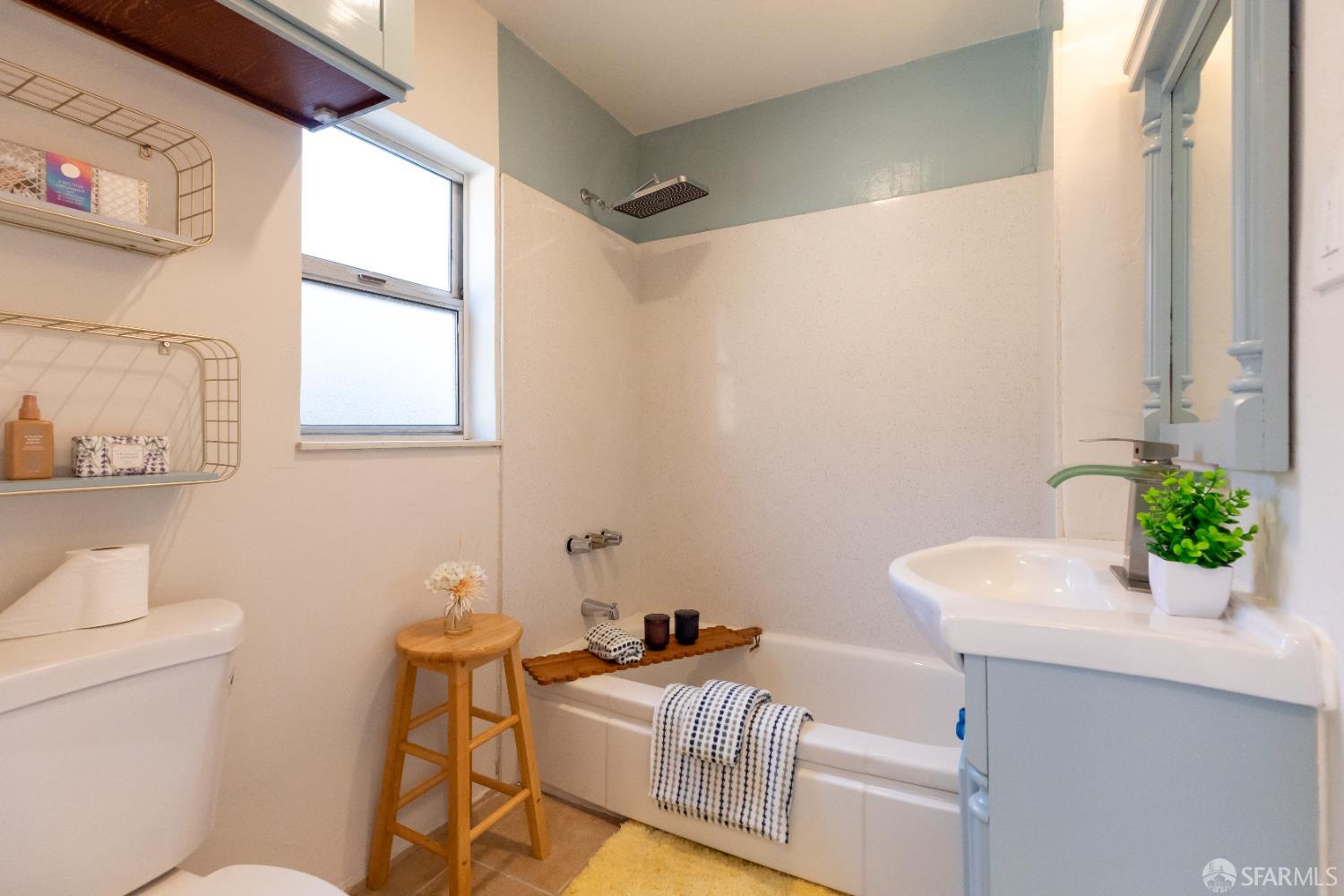 808 Fourth Street Rodeo, CA 94572 - Photo 23 of 70 a bathroom with a granite countertop sink and a mirror