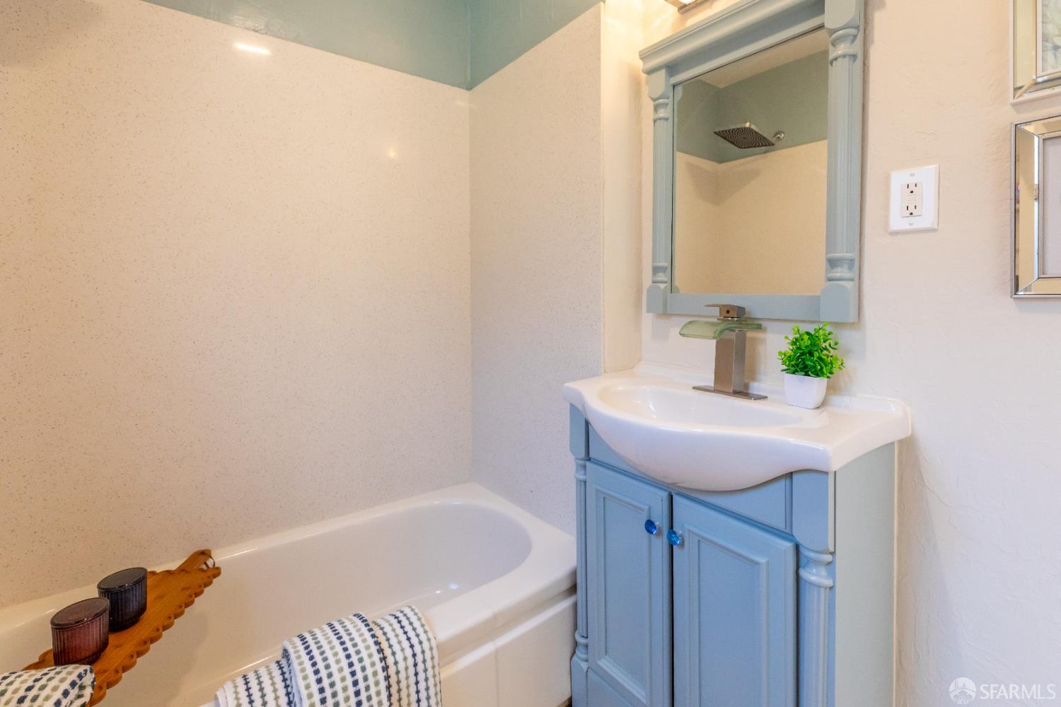 808 Fourth Street Rodeo, CA 94572 - Photo 25 of 70 a bathroom with a sink and a mirror