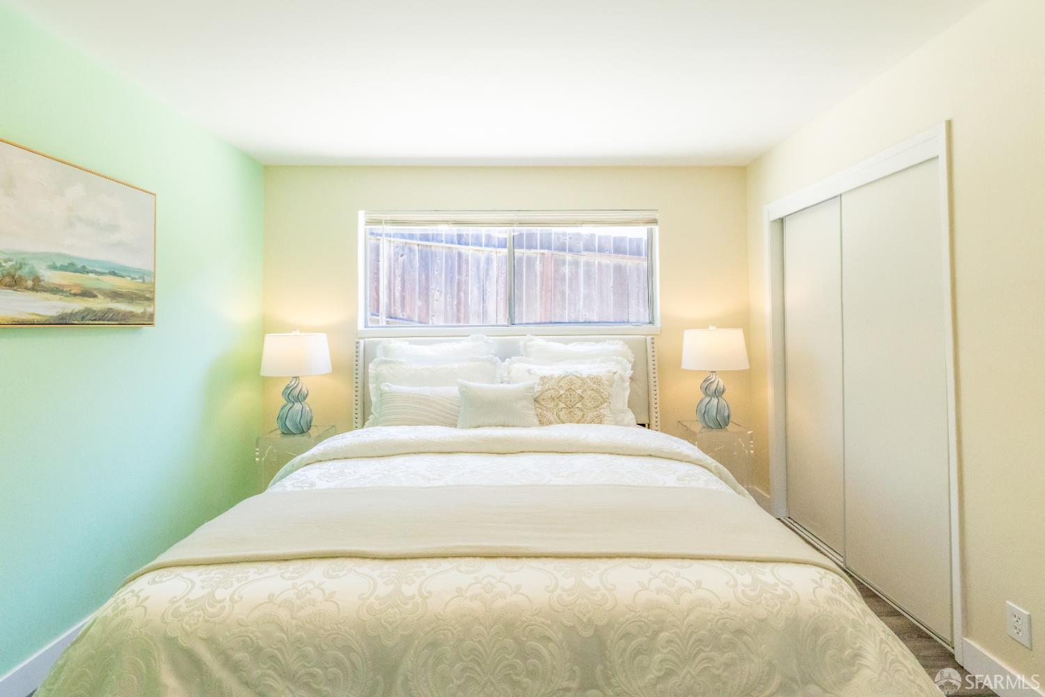 808 Fourth Street Rodeo, CA 94572 - Photo 30 of 70 a bedroom with a bed and a painting on the wall