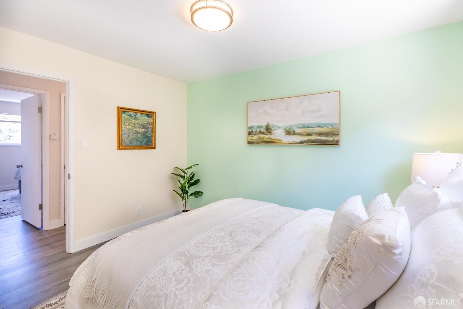 808 Fourth Street Rodeo, CA 94572 - Photo 33 of 70 a bedroom with a bed and a painting on the wall